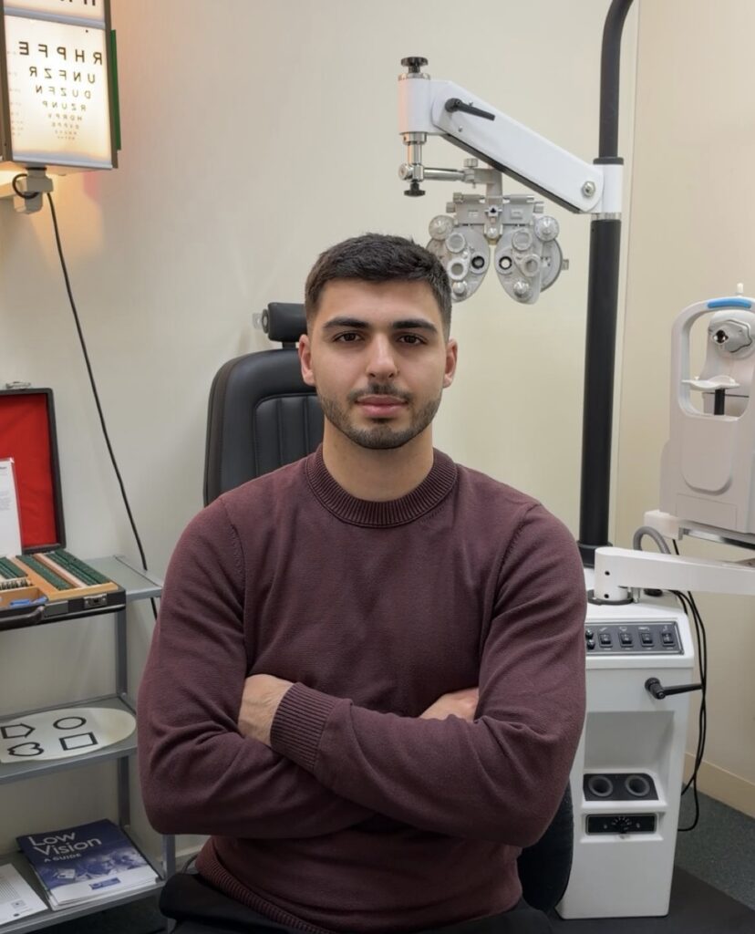 Dr Burak Ozdemir, optometrist, in the consulting room at Blackburn Village Optical